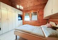 Chalet-Feeling mitten in Donaufeld - Naturstamm-Blockhaus mit Sauna, Kamin und Garten