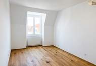 Lichtdurchflutete 3-Zimmer-Wohnung mit neuem Parkettboden, Grünblick und Garage