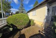 Bungalow mit Garage und großem Garten in Badener Grünruhelage!