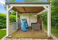 Zuhause im Grünen – Lichtdurchflutete Maisonette mit Gartenoase und Wasserblick