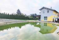 Einfamilienhaus mit großem Garten und Schwimmteich