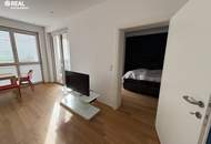 Neuwertige 2-Zimmer-Eigentumswohnung mit Kamin, Loggia und Garage