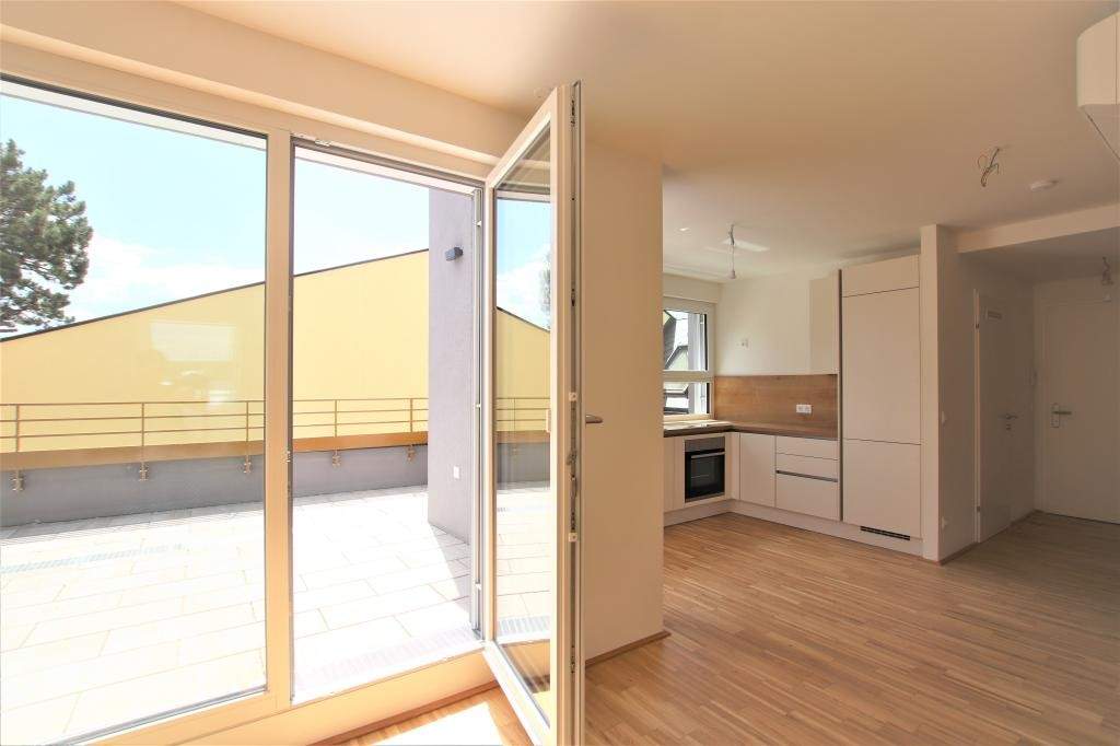 Luxus in Strebersdorf: Dachgeschoßwohnung mit großer Hofterrasse und Klimaanlage im Niedrigenergiehaus mit Fitnessraum!