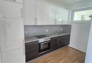 Moderne Neubauwohnung in mondäner Wohngegend mit Balkon