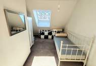 Zentrumsnah wohnen, Ruhe genießen – 3-Zimmer-Dachgeschoß-Wohnung mit Gartenblick