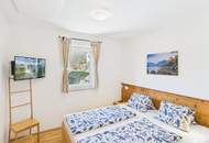 Etabliertes Ferienhaus-Ensemble am Millstätter See. Zwei moderne Häuser mit bestehender Vermietung. Investment.