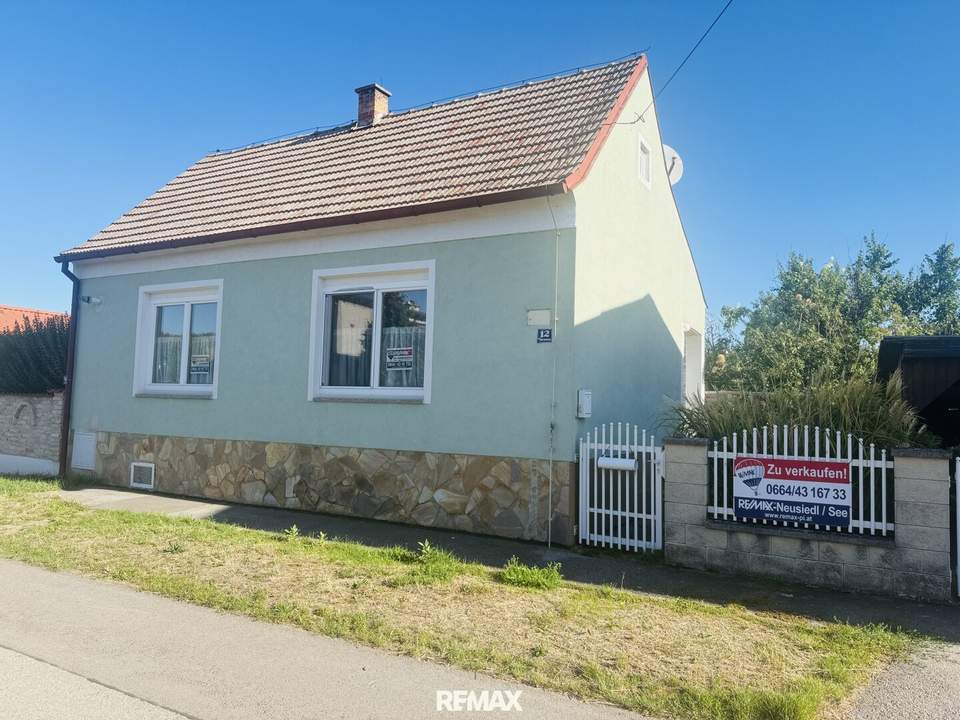 Einfamilienhaus mit Naturgarten,Werkstatt, beheizbares Nebengebäude, Carport