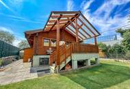 Chalet-Feeling mitten in Donaufeld - Naturstamm-Blockhaus mit Sauna, Kamin und Garten