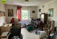 7,6 % Rendite – vermietete Doppelhaushälfte mit zusätzlicher Wohneinheit zur Renovierung und Selbstnutzung.