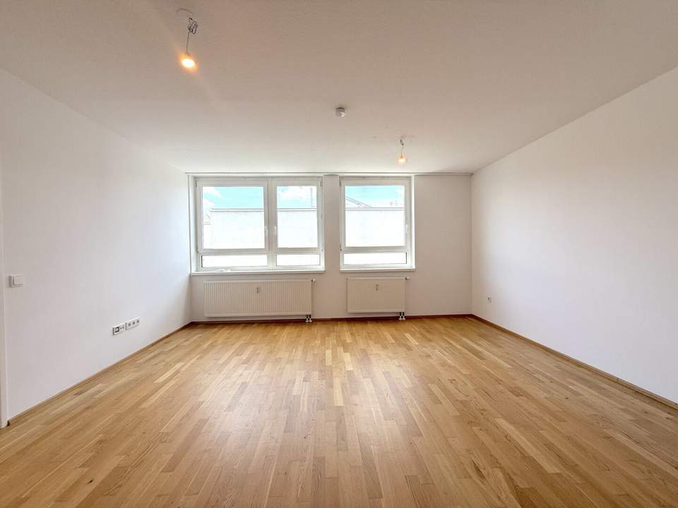 Hofseitig orientierte Zwei-Zimmer-Wohnung mit Einbauküche