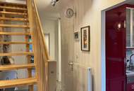 Mauer "Licht. Ruhe. Effizienz. Stilvolle Maisonette mit Südterrasse" | ZELLMANN IMMOBILIEN