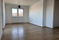Erdgeschoßwohnung mit eigenem Gartenanteil in zentraler Lage