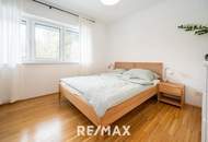 Hochwertige 3-Zimmer-Wohnung mit Tischlerküche, 160 m² Eigengarten, Terrasse und Garage in ruhiger, grüner Lage!