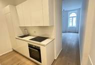 Sanierter Altbau: Charmante 2-Zimmer-Wohnung mit separater Küche