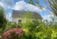 Gepflegtes Einfamilienhaus mit großer Terrasse und vielen Garagen!