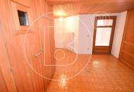 Einfamilienhaus in zentraler Bestlage mit Tennisplatz auf parkähnlichem Grund!