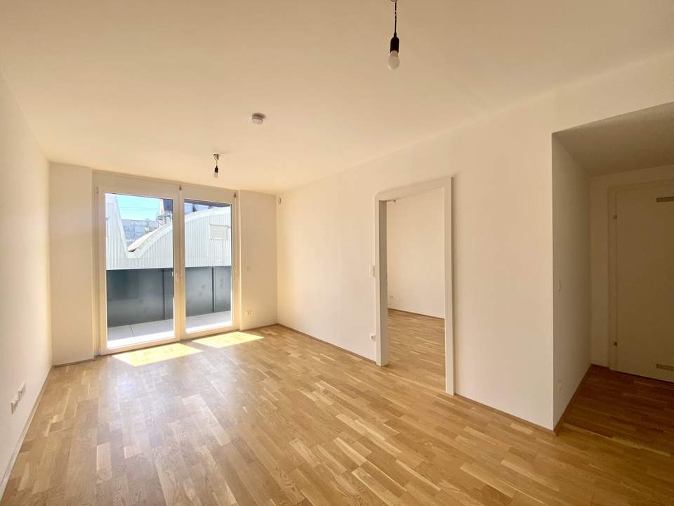Perfekt geschnittene 2-Zimmer-Wohnung mit Balkon und Gemeinschafts-Dachterrasse