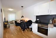 Top vermietete Anlegerwohnung mit Balkon und Tiefgarage - Neuwertig!