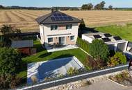 Wohnkomfort trifft Natur – Modernes Holzriegelhaus mit Pool und Garten auf Baurechtsgrund in Krenstetten