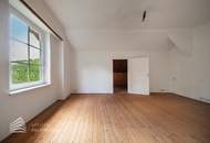 Sanierungsbedürftiges Wohnhaus mit 24 Wohneinheiten in Hanglage