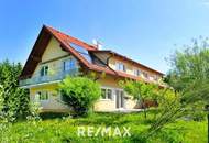 Hochwertige 3-Zimmer-Wohnung mit Tischlerküche, 160 m² Eigengarten, Terrasse und Garage in ruhiger, grüner Lage!