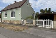 Entzückendes Einfamilienhaus mit Naturgarten, Nebengebäude und Carport