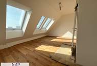 Helle und freundliche 2-Zimmer DG Wohnung mit Balkon und großer Dachterrasse mit 360° Stadtblick!