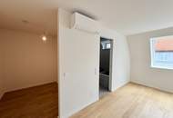 Eleganz trifft Lage – Neubau-Dachgeschosswohnung in Toplage