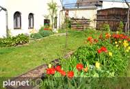 Ebenerdiges Wohnhaus inklusive Einliegerwohnung und romantischem Bauerngarten!