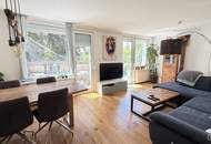Mauer "Licht. Ruhe. Effizienz. Stilvolle Maisonette mit Südterrasse" | ZELLMANN IMMOBILIEN