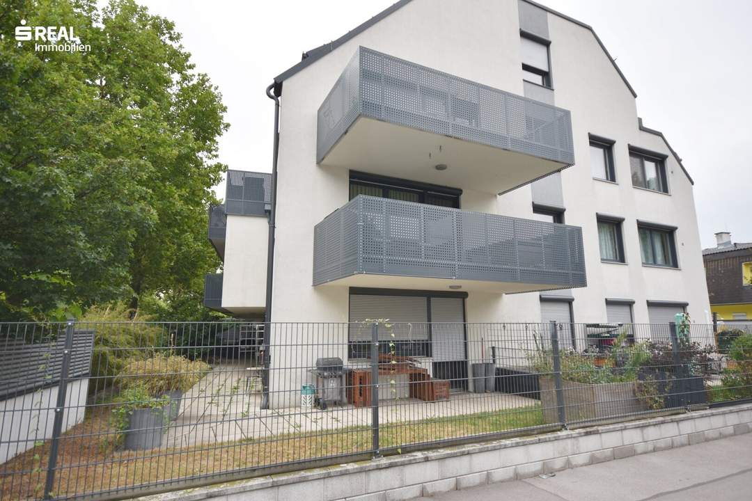 Moderne Neubau Gartenwohnung mit Tiefgaragenplatz!