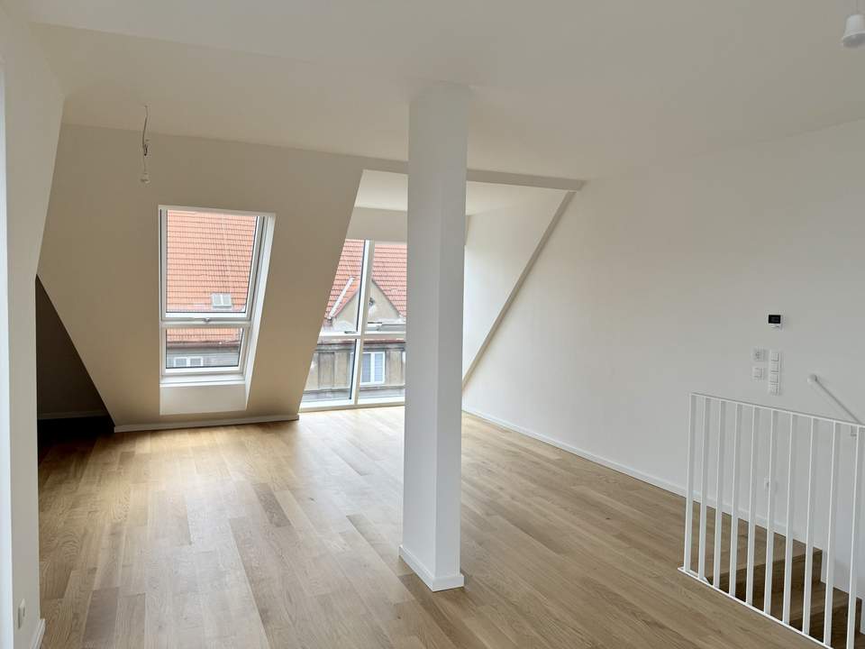 Eleganz trifft Lage – Neubau-Dachgeschosswohnung in Toplage