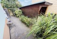 Entzückendes Einfamilienhaus mit Naturgarten, Nebengebäude und Carport