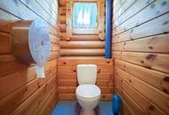 Chalet-Feeling mitten in Donaufeld - Naturstamm-Blockhaus mit Sauna, Kamin und Garten