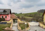 "Charmantes Einfamilienhaus mit Terrasse, Garage und zusätzlichem Grundstück"