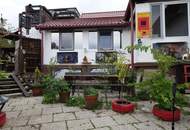 Einfamilienhaus mit drei eigenständigen Wohnungen und einzigartigem Erlebnisgarten