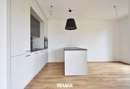 Exklusive Neubauwohnung mit moderner Küche, 37 m² Balkon und TG-Stellplatz in sonniger Lage!