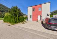 DREI SEEN. EIN ZUHAUSE. – Modernes Wolf Haus mit Garten und Vollkeller in Feld am See