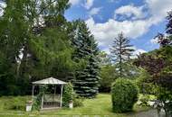 Mitten im Grünen & im Villenviertel: exklusive Gartenwohnung mit ca. 930 m² Außenfläche, beheiztem Wintergarten, Pool, Luftwärmepumpe u.v.m.!