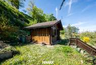 Gepflegtes Einfamilienhaus mit 2 Wohneinheiten, Garten/Terrasse &amp; 3 Garagen in sonnige Ruhelage!