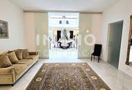 Zeitlose Architektur trifft Großzügigkeit - Designvilla mit Indoor-Pool und Einliegeroption