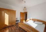 Kärntner Wohncharme in Seenähe – 5-Zimmer-Wohnung mit Kachelofen & Balkon