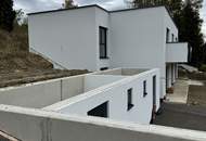 Modernes Zweifamilienhaus mit Gartenwohnungen – Erstbezug!