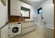 Neubau-3-Zimmer mit 14 m²-Balkon, Tiefgarage & Blick auf den Wienerberg
