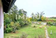 Zweifamilienhaus mit großem Grundstück und Entwicklungspotenzial in Ruhelage