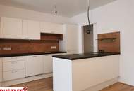Hofseitig ausgerichtete 2-Zimmer-Wohnung mit großem Balkon und Hochbeet
