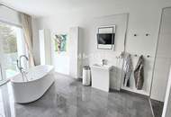 Zeitlose Architektur trifft Großzügigkeit - Designvilla mit Indoor-Pool und Einliegeroption