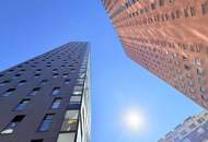„Wohnen mit Weitblick: Barrierefreie Wohnung im 11. Stock mit Loggia und Stellplatz“