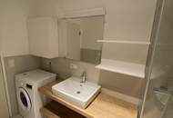 Moderne Neubauwohnung im Zentrum – mit Loggia u. Lift ! TIEFGARAGENPLATZ und KONTROLLIERTE WOHNRAUMBELÜFTUNG