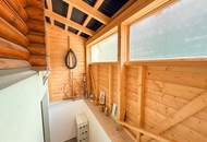 Chalet-Feeling mitten in Donaufeld - Naturstamm-Blockhaus mit Sauna, Kamin und Garten